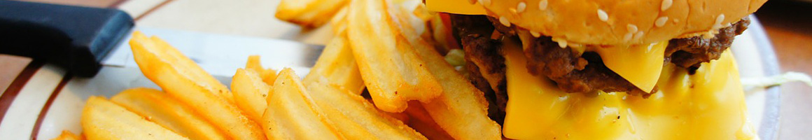 Eating Burger Fast Food at Tom's Jr restaurant in South Gate, CA.